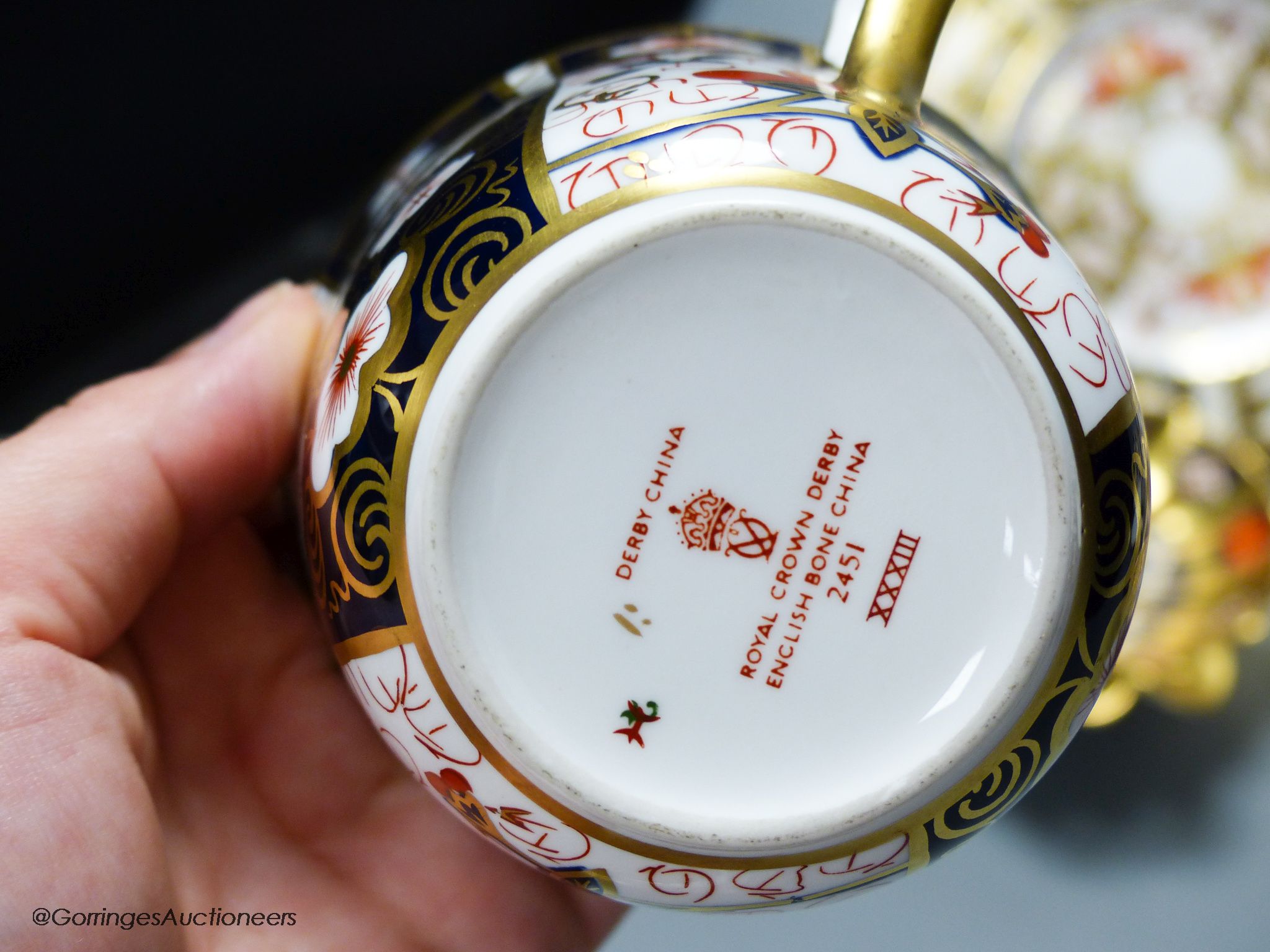 A quantity of Royal Crown Derby cups and saucers